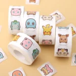 500PCS Anime Cute Pokemon Stickers Kawaii Pikachu Charizard Round Seal Stickers Rolls Stickers Graffiti Luggage Stickers Toys 1